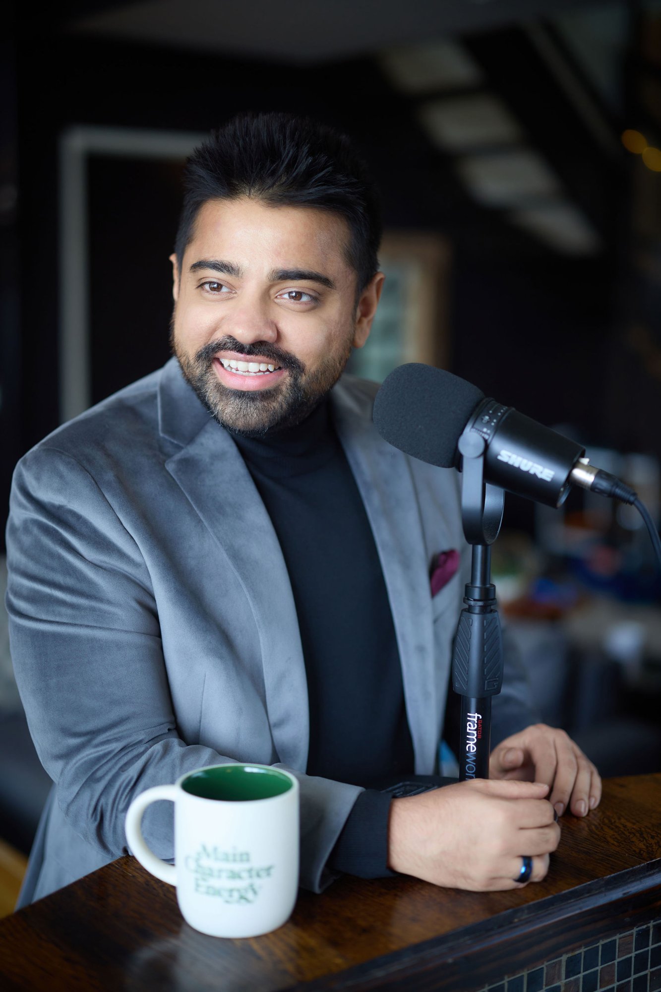 Dan Shaikh at the microphone - keynote speaker and emcee