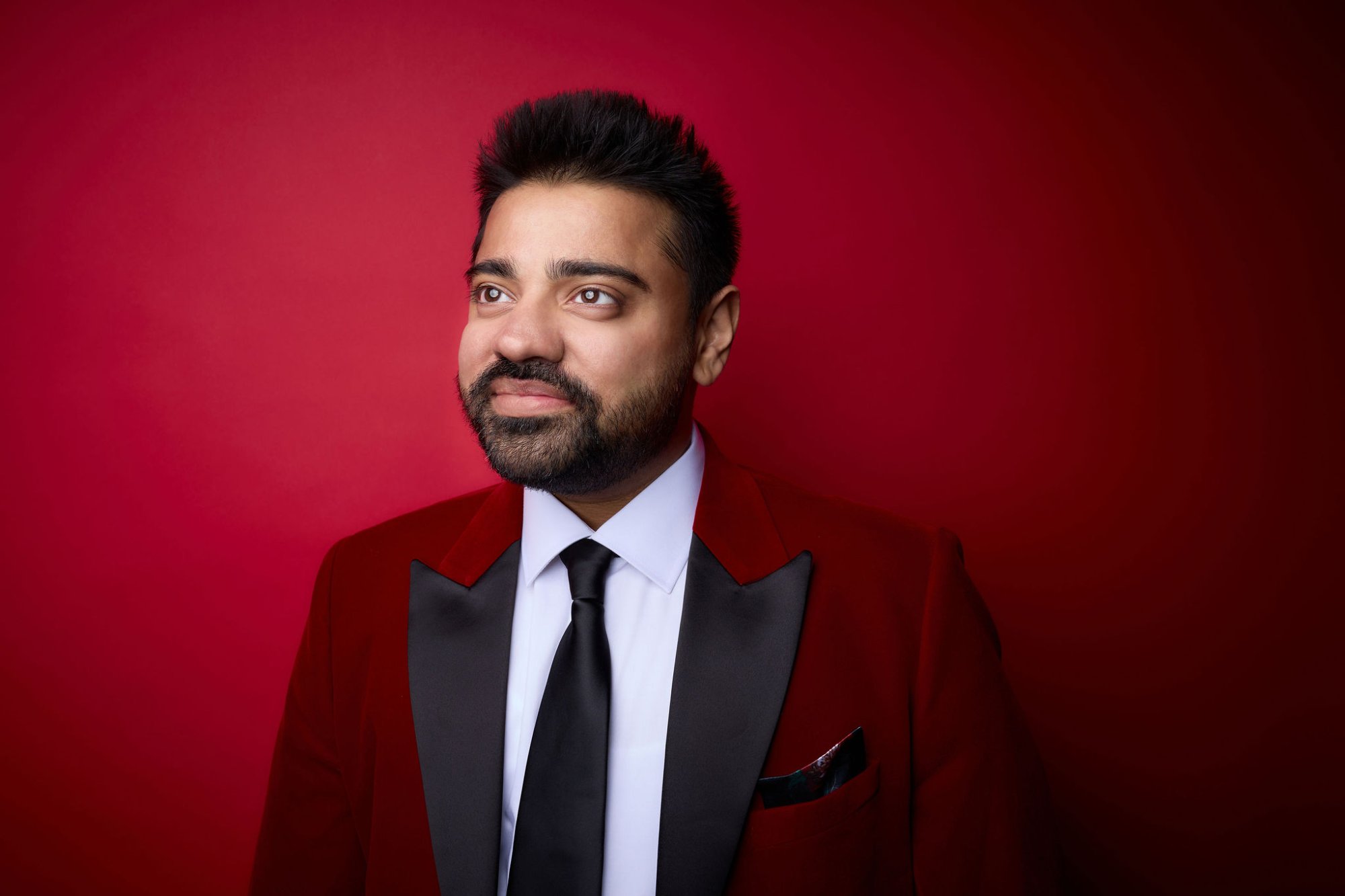 Dan Shaikh in red tuxedo - award-winning publicist