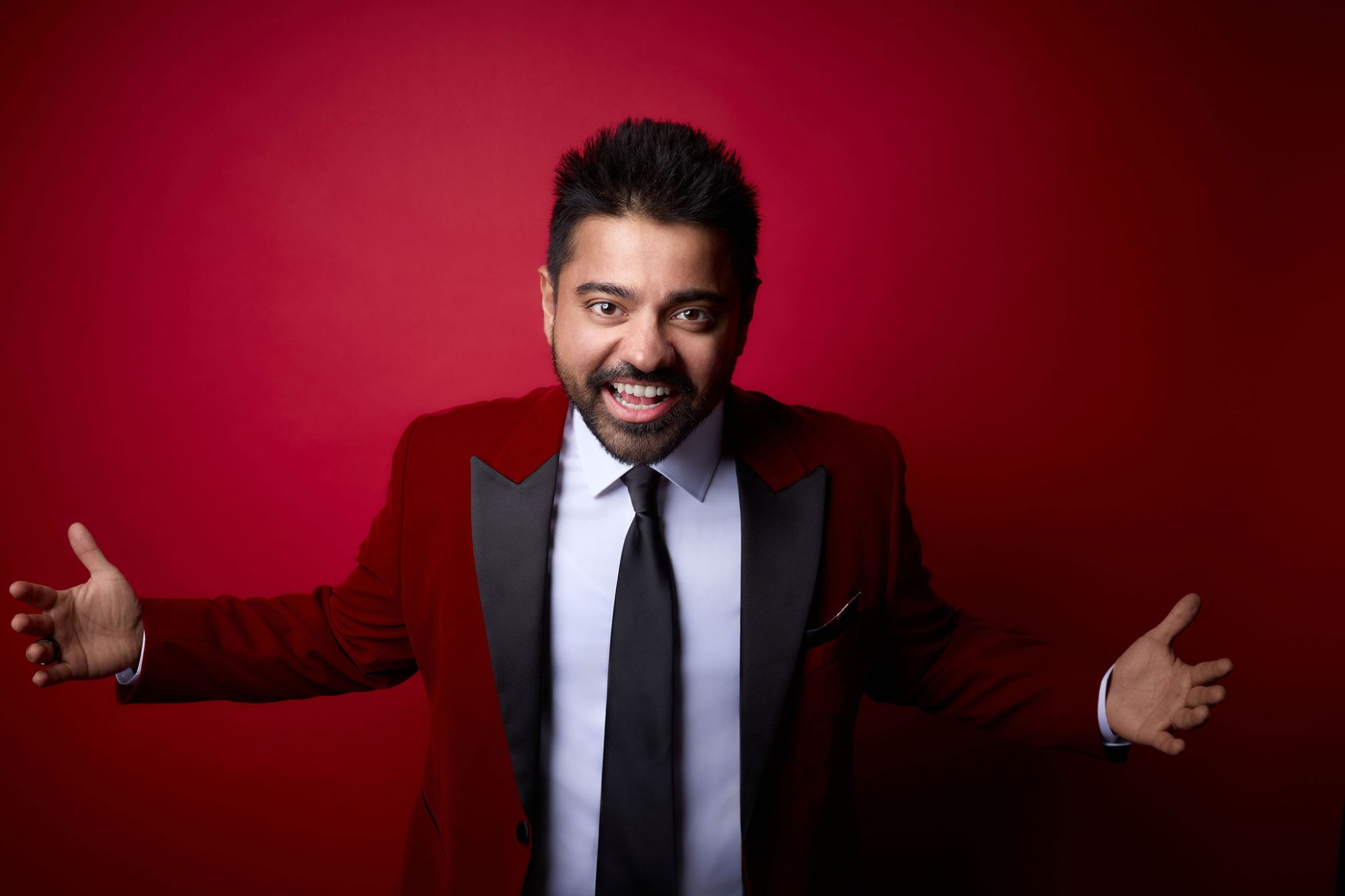 Dan Shaikh in red blazer - Brand Visibility Expert